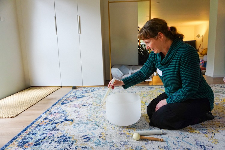 IKSRE workshop participant playing Crystal singing bowl IKSRE workshop participant playing Crystal singing bowl