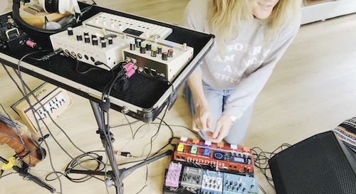 IKSRE with her loop and effects pedals and synths